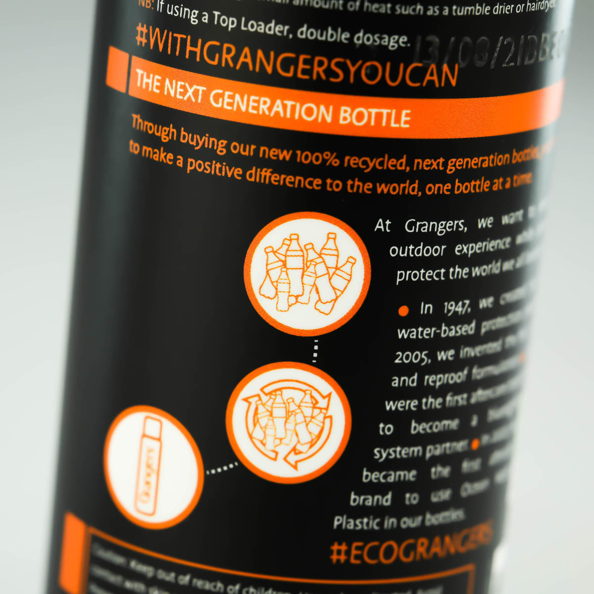 Close-up of the Clothing Repel bottle showing the recycled-bottle information panel