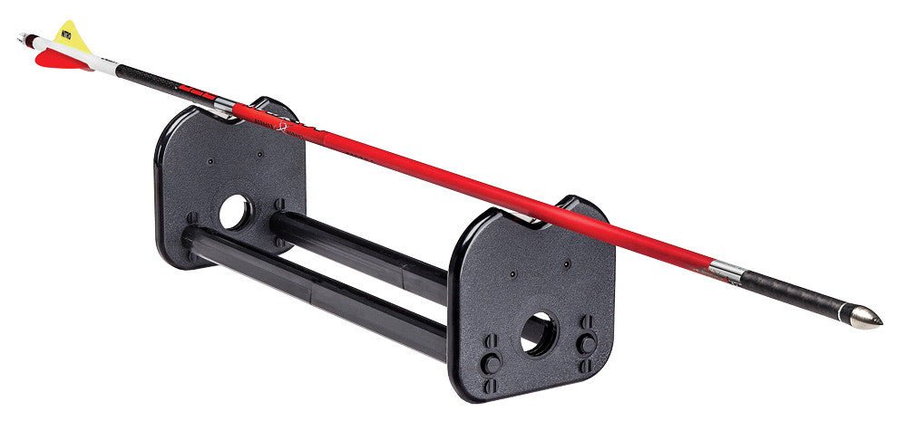 Pine Ridge Archery Arrow Inspector spin tester with an arrow resting on its aluminium wheels