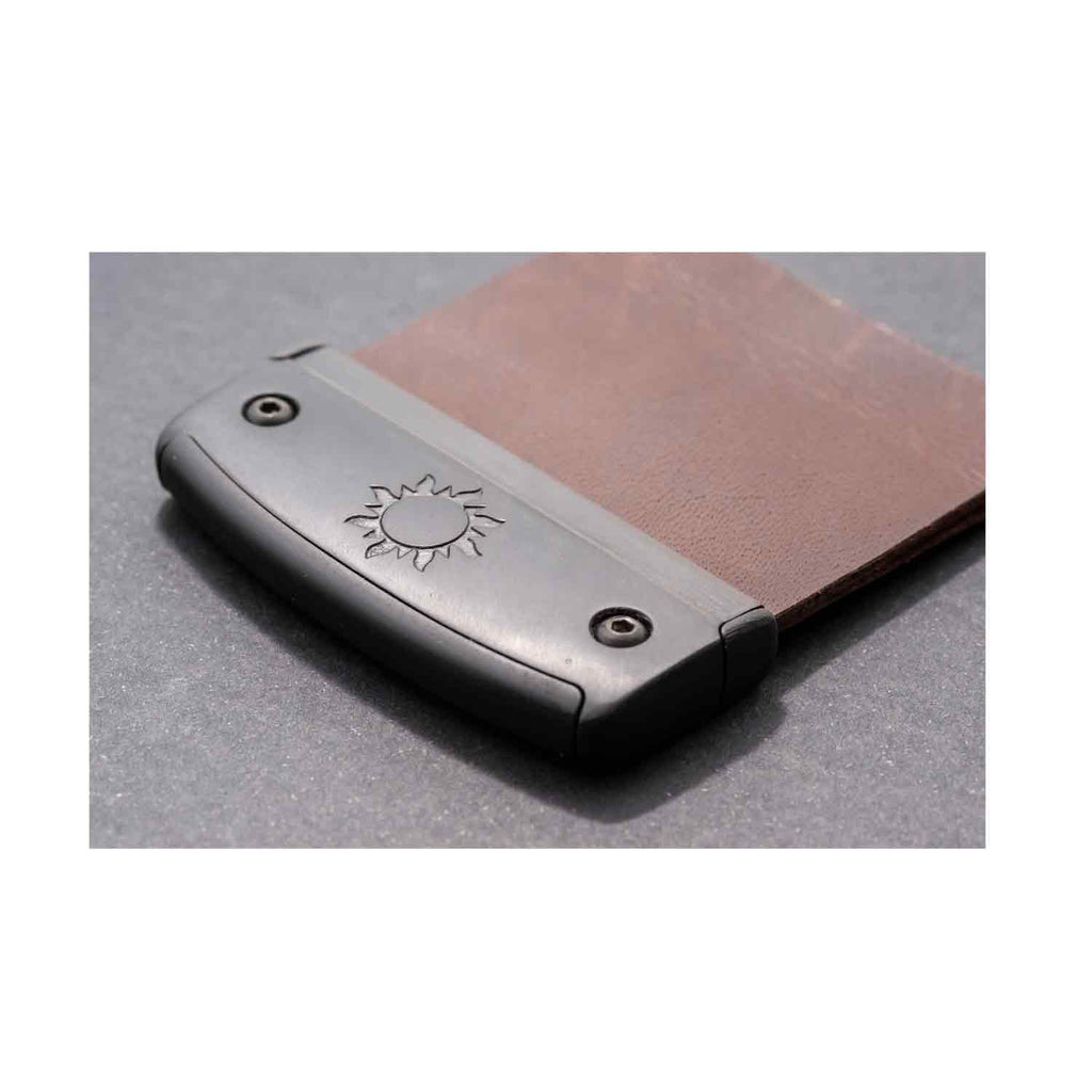 Underside of the Fairweather barebow tab showing the plate and leather face