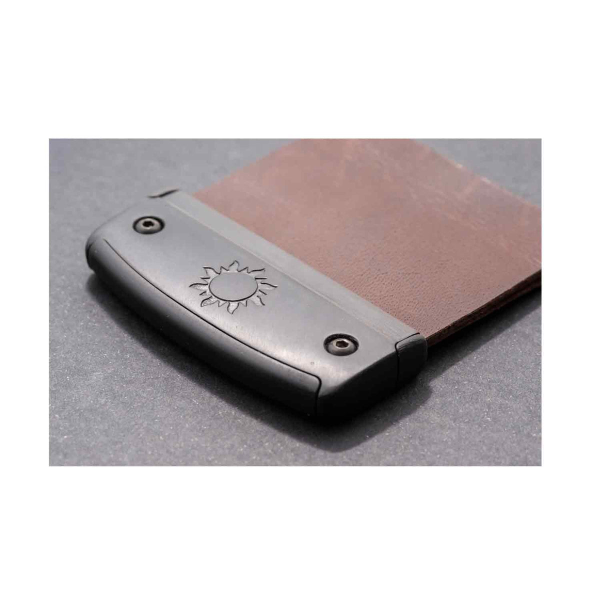 Underside of the Fairweather barebow tab showing the plate and leather face