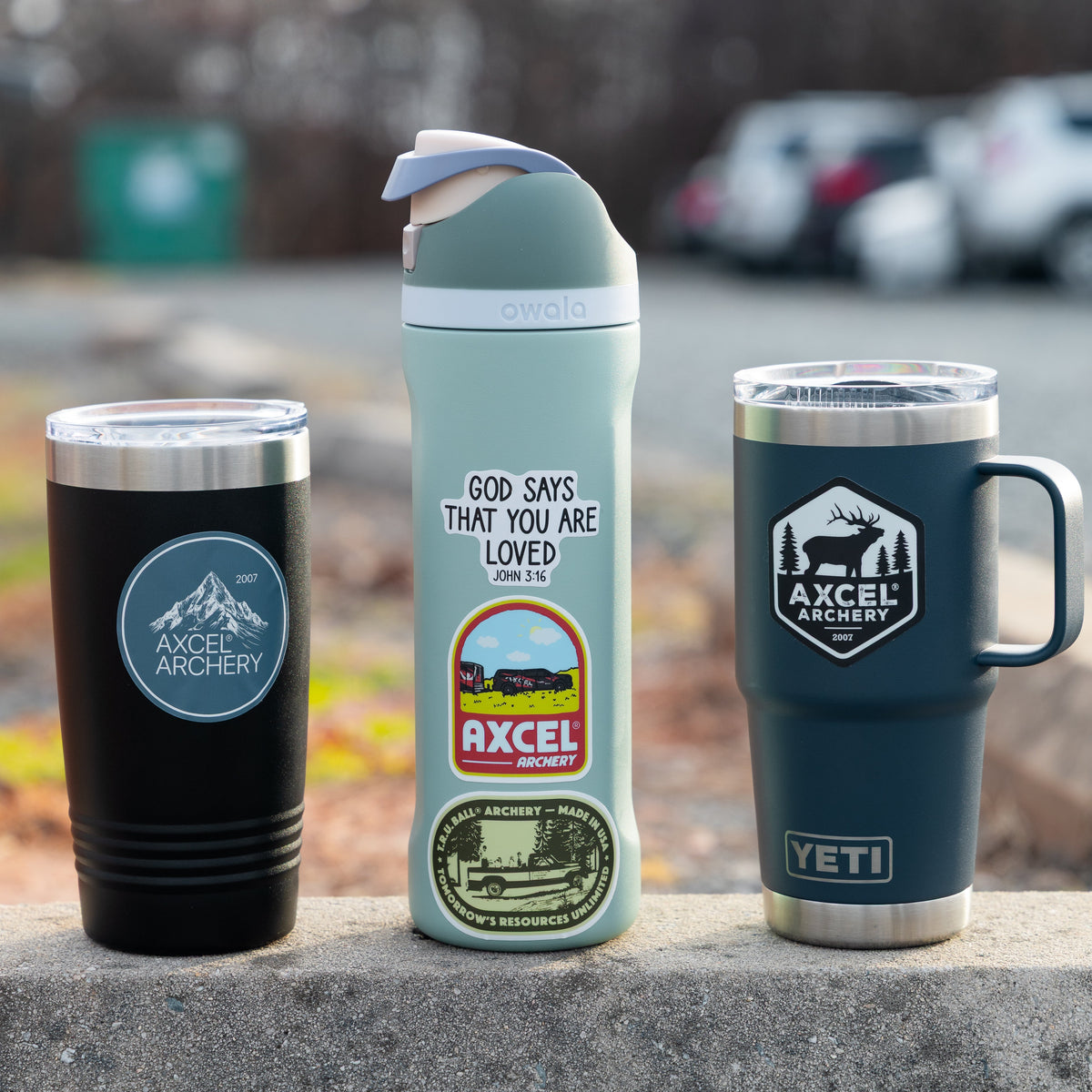 T.R.U. Ball and Axcel stickers applied to tumblers and a water bottle