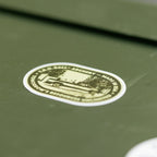 T.R.U. Ball Nostalgia sticker in Olive Drab Green applied to a hard case