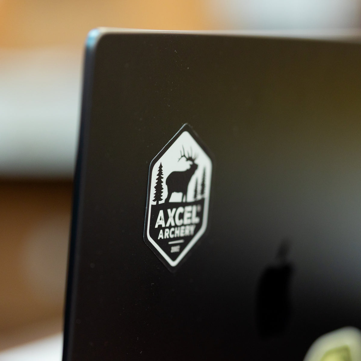 Axcel Elk sticker in Black applied to a laptop lid