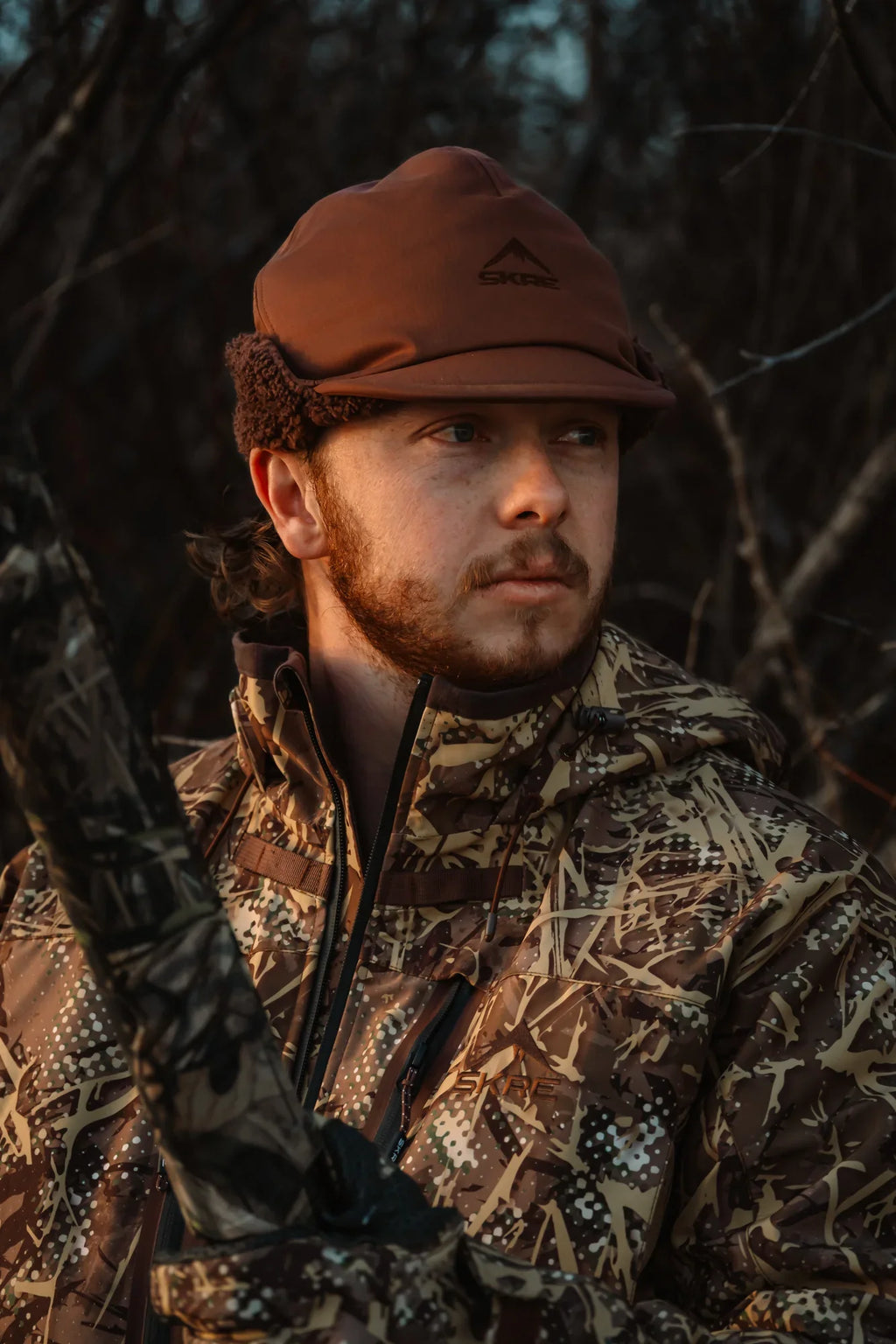 SKRE Boreal Beanie, Layout Brown, worn in the field