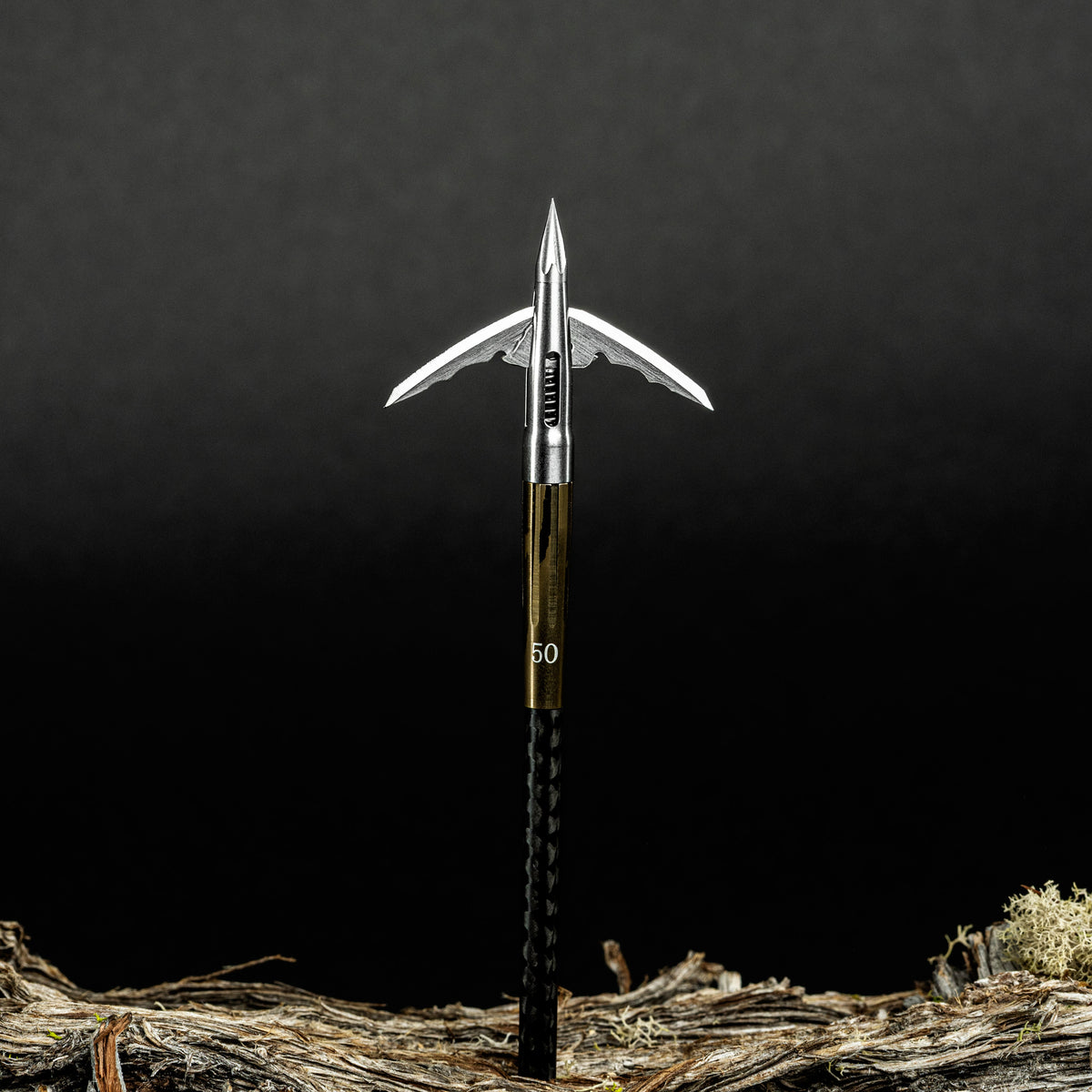 Beast 2.0in 150g Stainless Steel Broadhead mounted on arrow, blades deployed