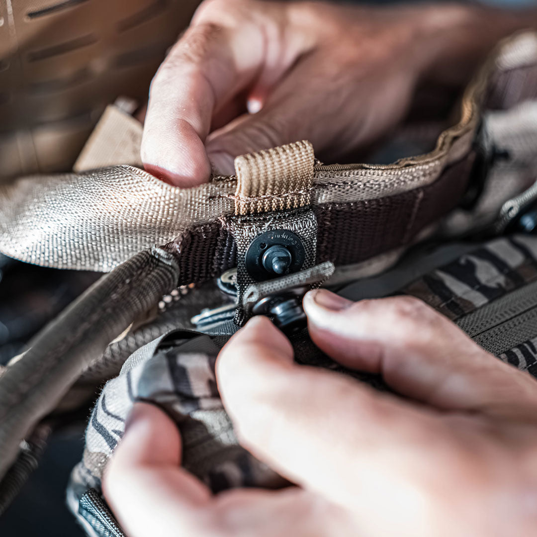 Tethrd RAD System being attached to MOLLE