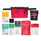 Stone Glacier First Aid Kit, full kit contents laid out with the red pocket