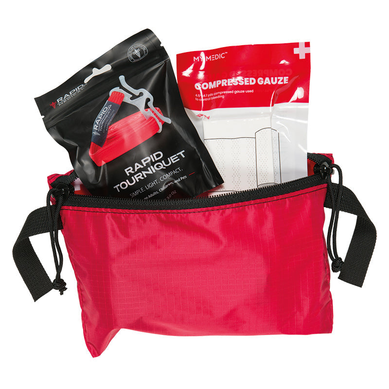 Stone Glacier First Aid Kit, red Swing Out Pocket open with tourniquet and compressed gauze