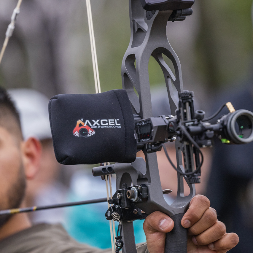 Axcel Scope Cover, Black, in place on a target bow sight