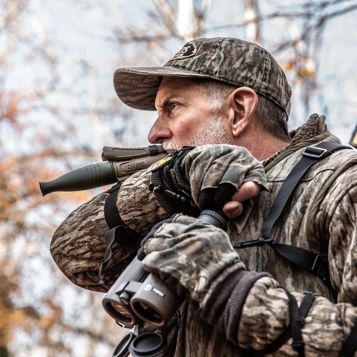 Hunter calling with the Primos Buck Roar II in the field