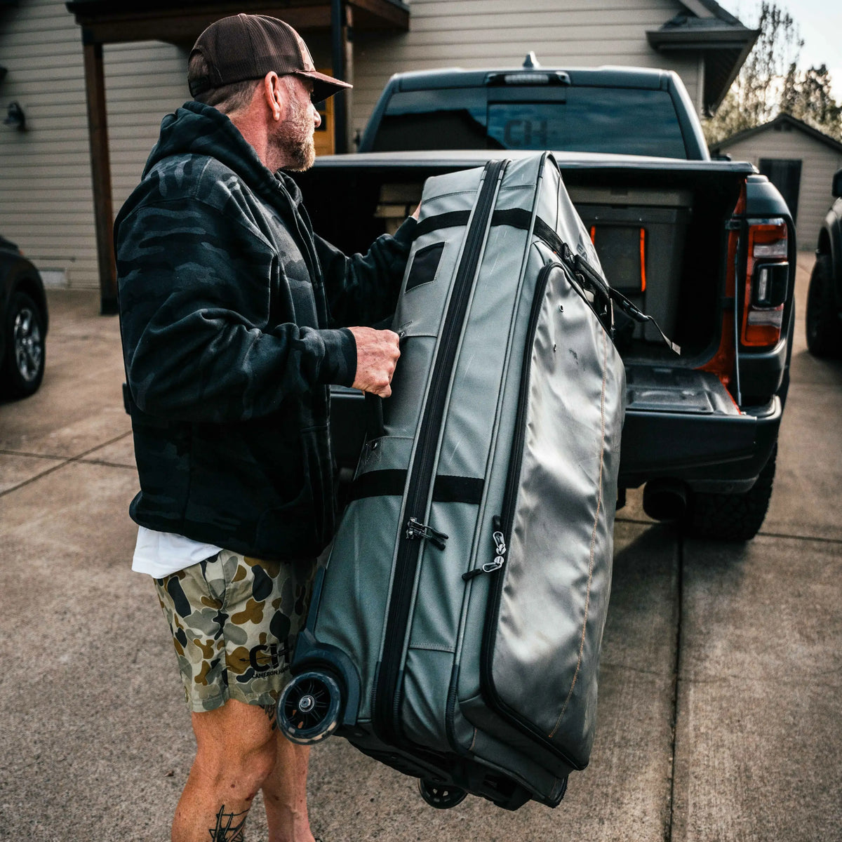 Easton Bow Truk travel bowcase being loaded into a truck