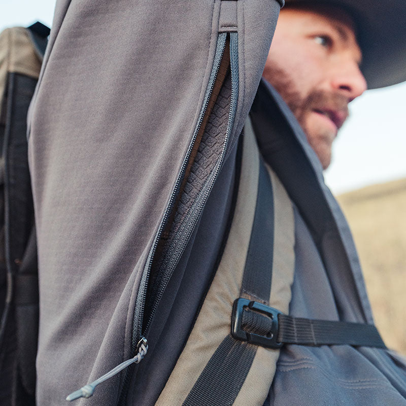 Stone Glacier Headwall Jacket, zippered chest pocket detail worn with a pack