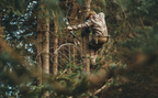 Saddle hunter climbing with Tethrd One Sticks