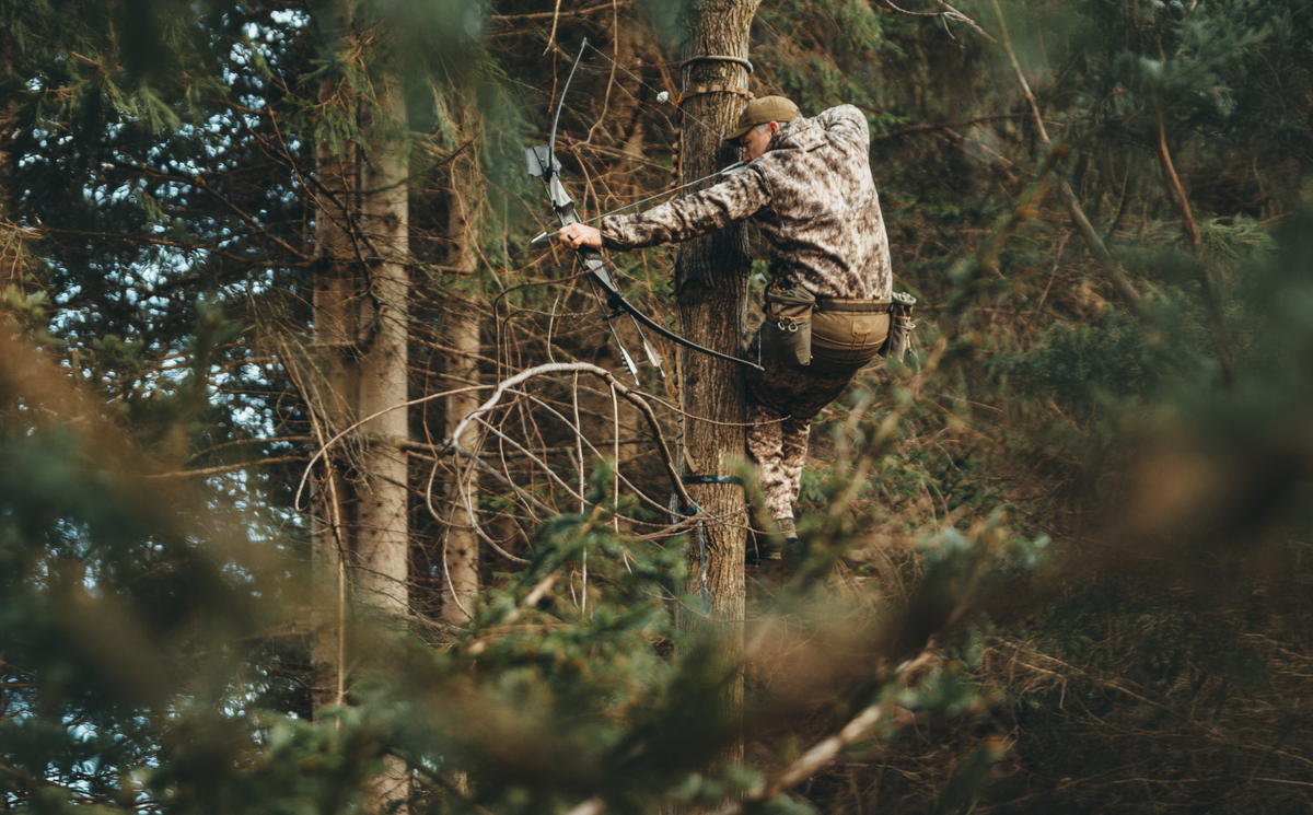 Saddle hunter climbing with Tethrd One Sticks