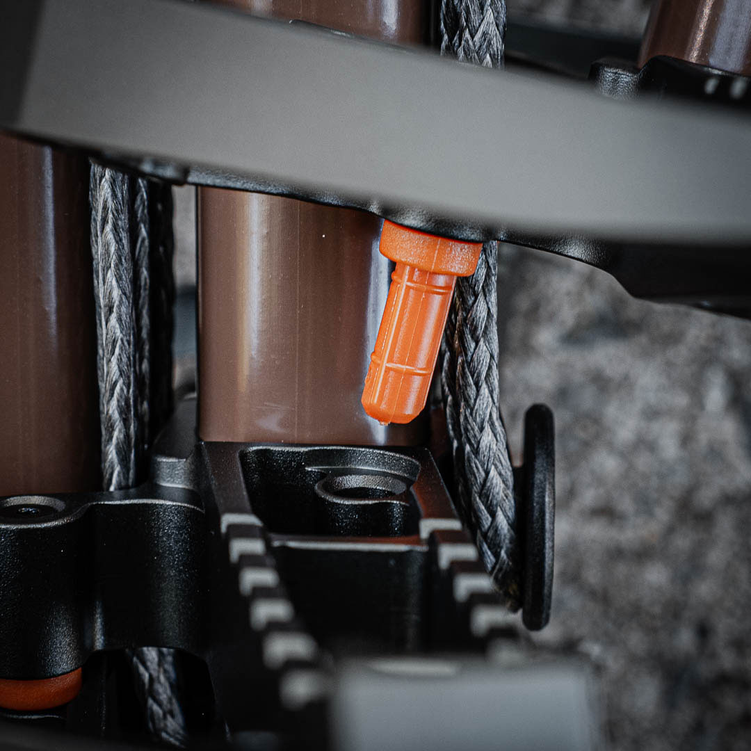 Tethrd StickLoc pin installed on a climbing stick