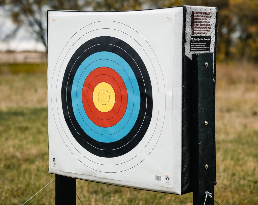 RangeDog PLUS archery target on outdoor stand with a FITA face pinned to it