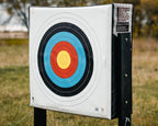 RangeDog PLUS archery target on outdoor stand with a FITA face pinned to it