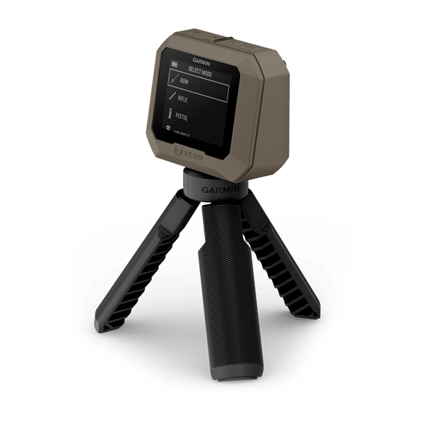Angled view of the Garmin Xero C1 Pro on its tripod with the bow, rifle and pistol mode menu on screen