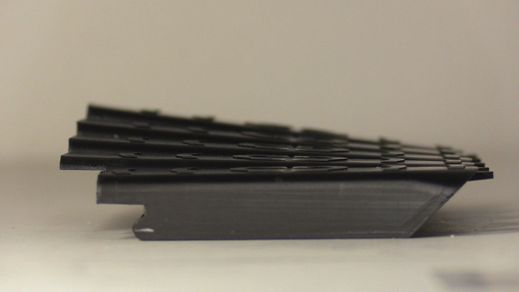 Bedford Archery grip backings stacked to show the angle differences