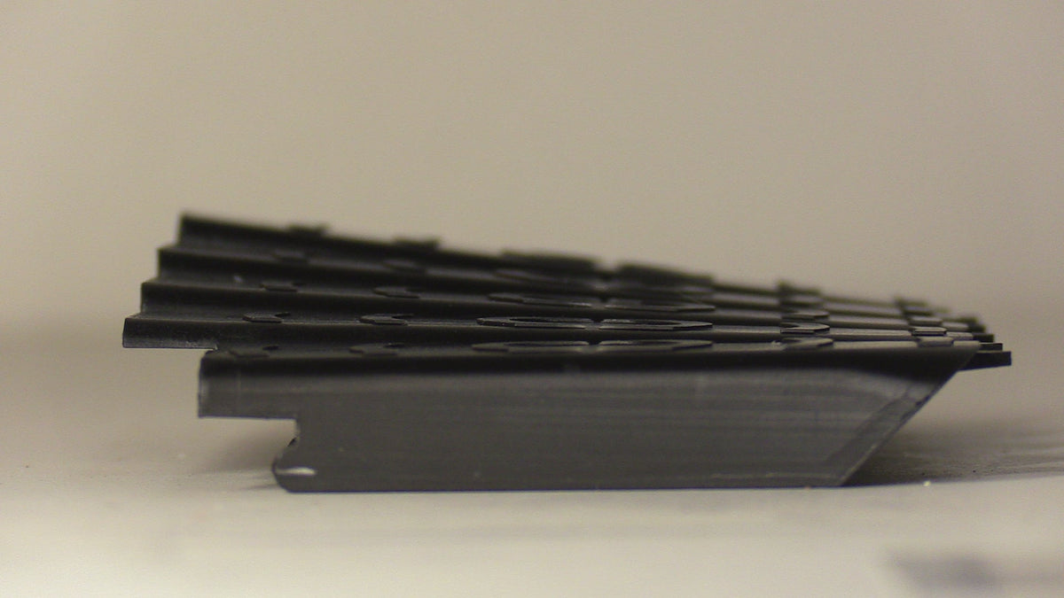 Bedford Archery grip backings stacked to show the angle differences