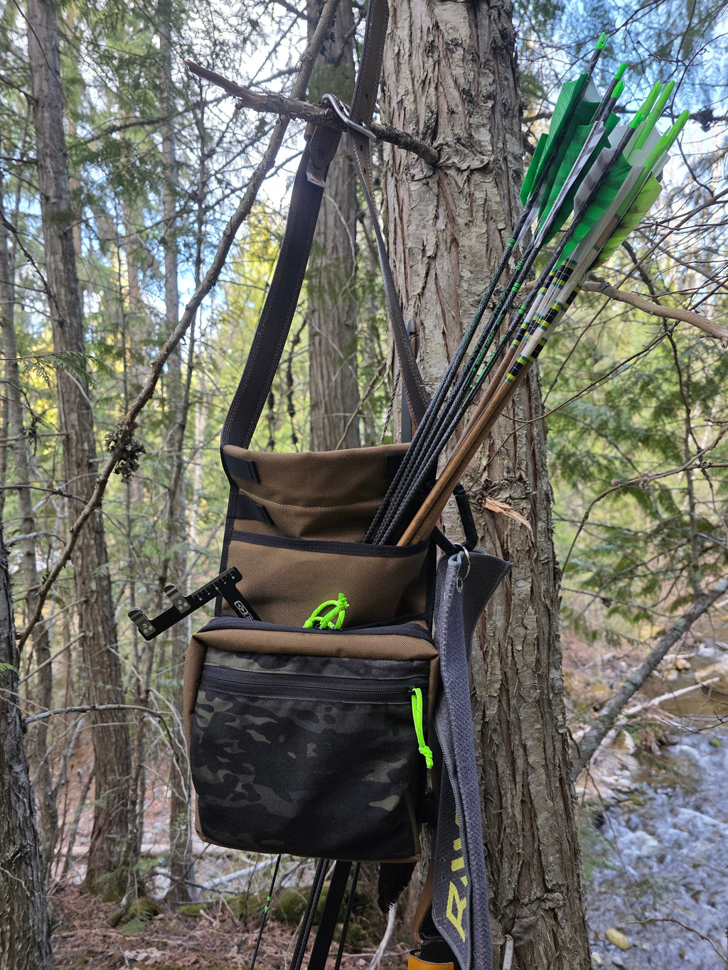 Coyote and MultiCam Black hip quiver loaded with arrows