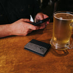 Stone Glacier Sawbuck Wallet, Graphite, everyday carry on a table
