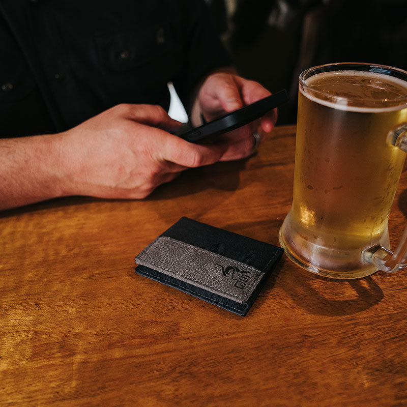 Stone Glacier Sawbuck Wallet, Graphite, everyday carry on a table