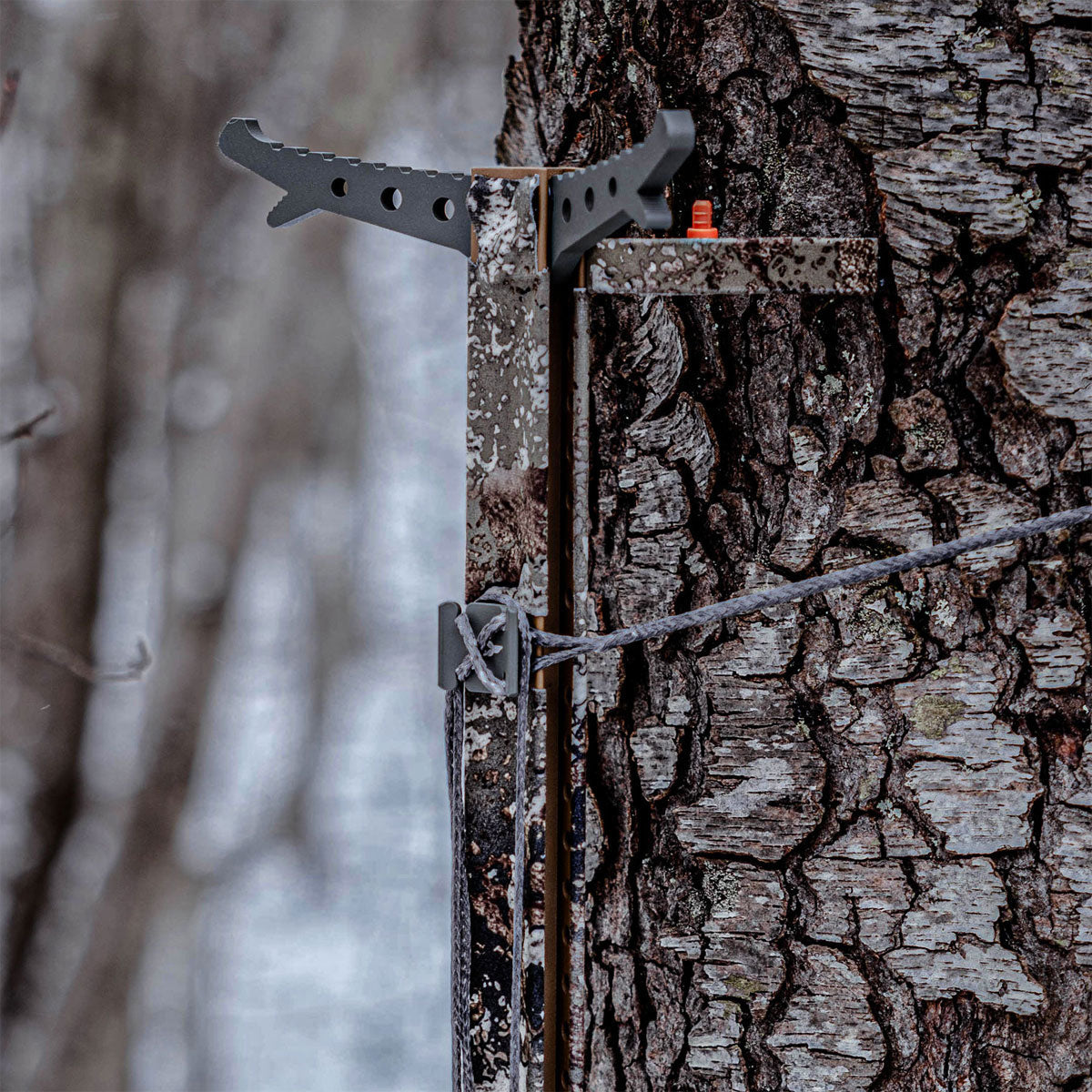 Tethrd Stealth Strips on a climbing stick in the field