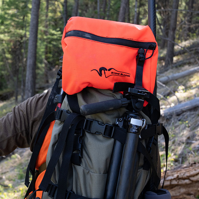 Stone Glacier Sky Series Lid, Blaze Orange mounted on a pack